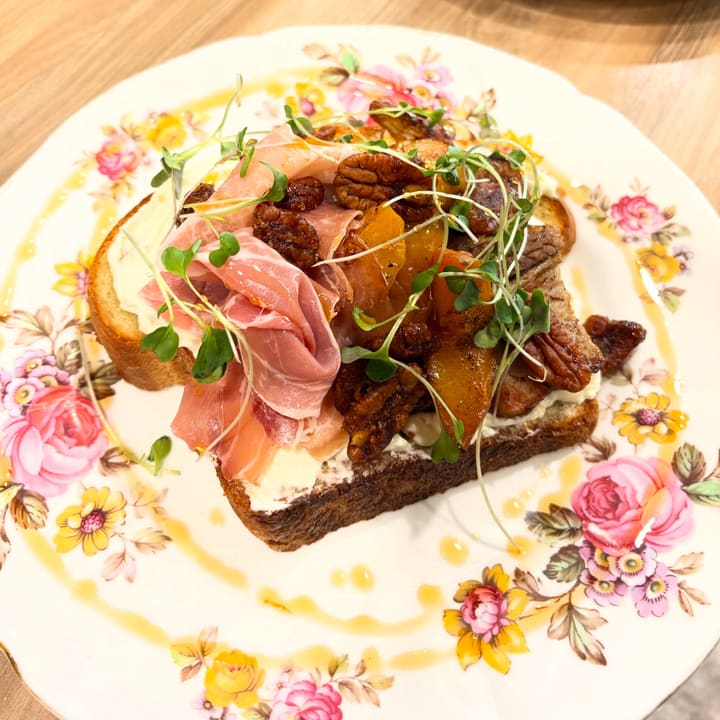 pig & peach 🍑 whipped brie, pork belly, roasted peaches, candied pecans, prosciutto & chili oil